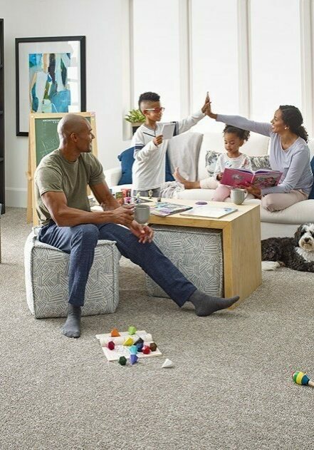 Family sat on carpet floor | Floor to Ceiling - Mitchell
